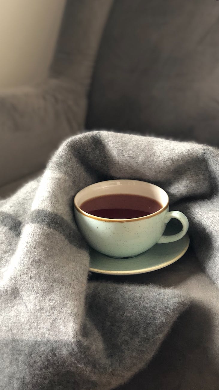 white ceramic cup on saucer